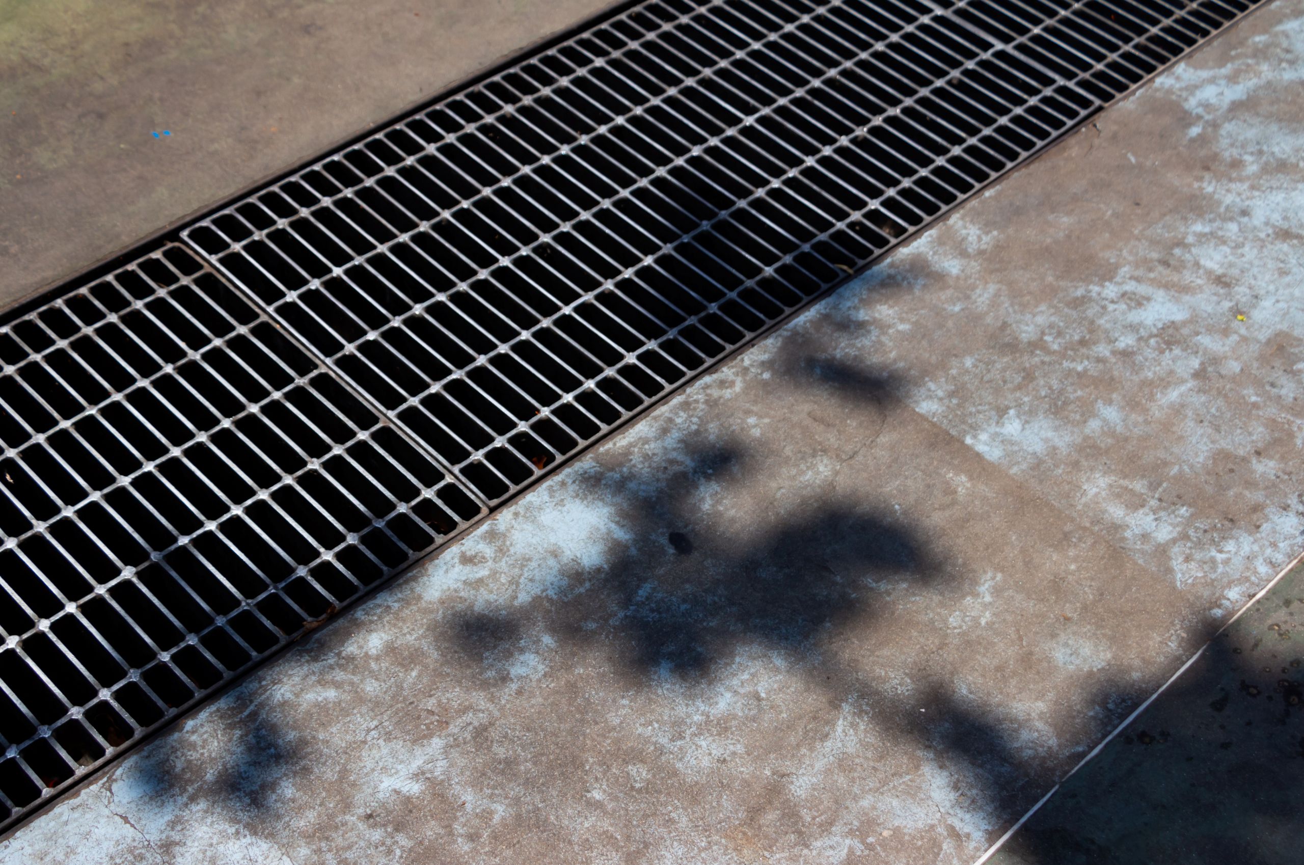 metal-grid-on-the-sewerage-canal-commercial-services