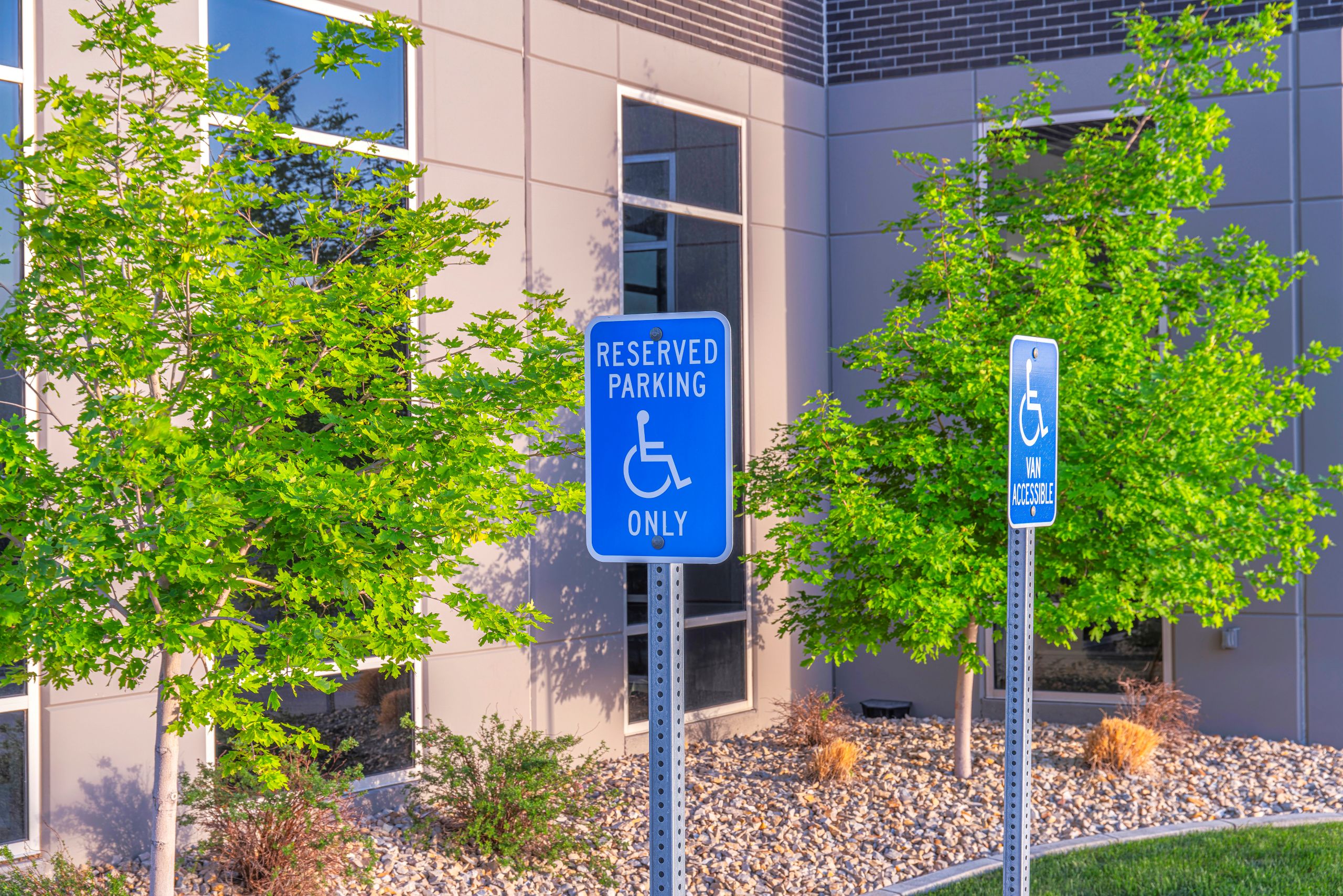 accessible-parking-signs-in-landscaped-office-area-ADA
