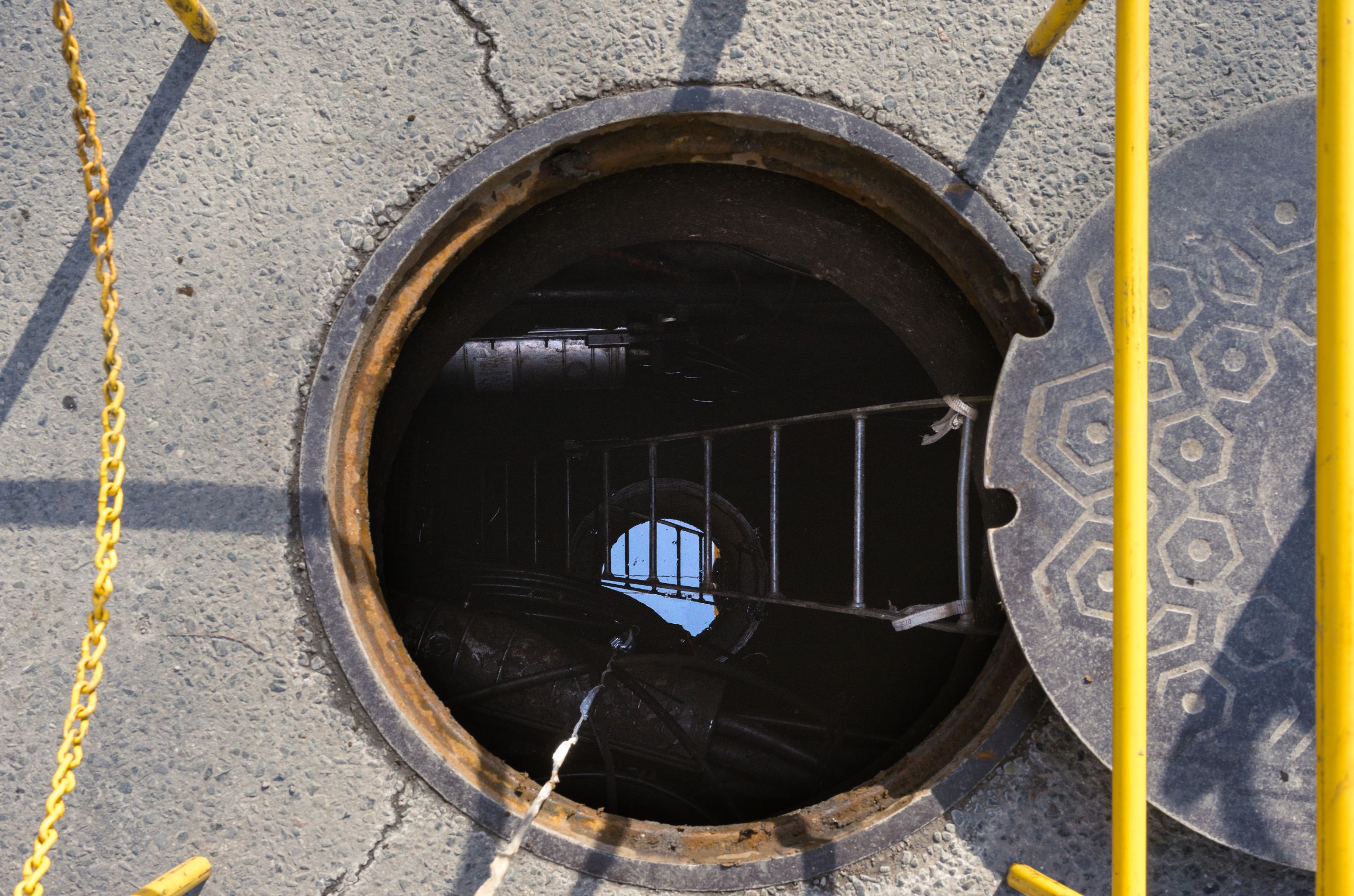 open manhole in city street commercial